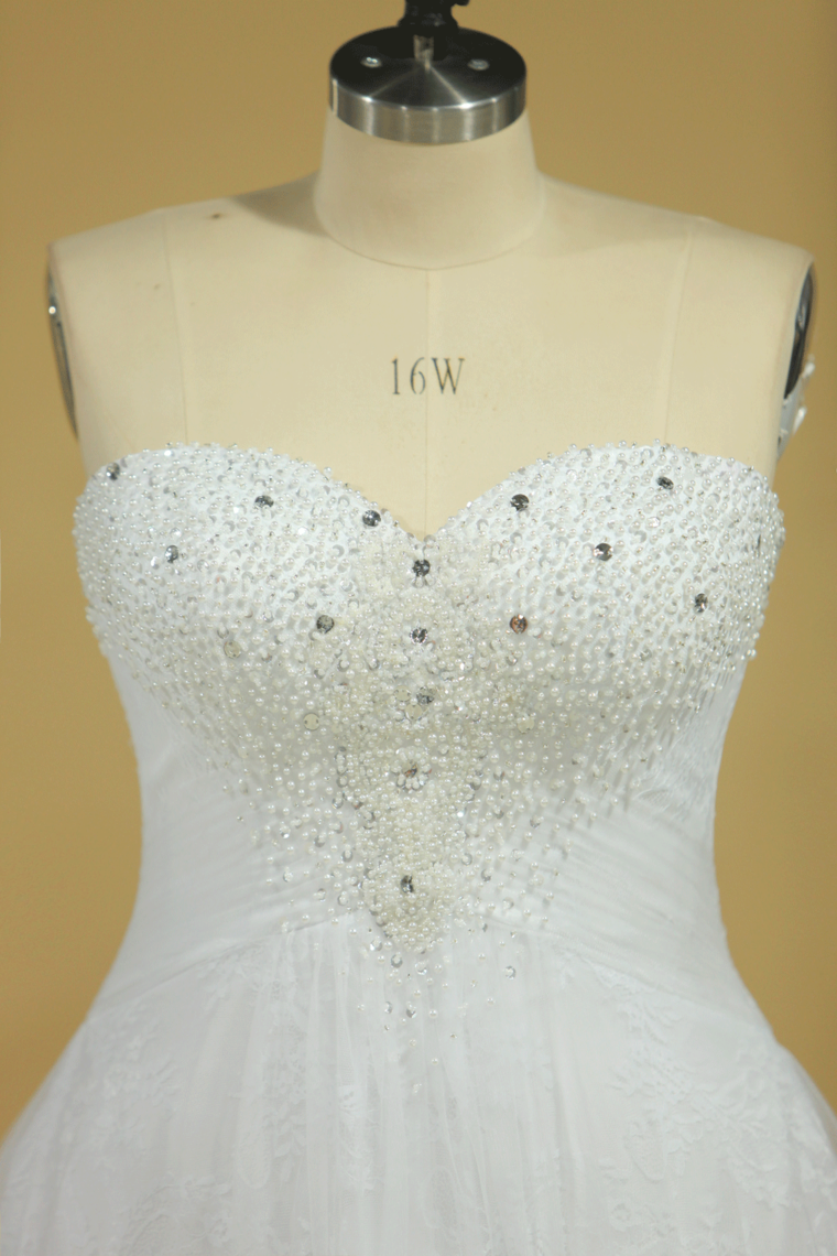 2022 Plus Size Sweetheart Beaded Bust Empire Waist A Line Wedding Dress Chapel Train Tulle With Lace